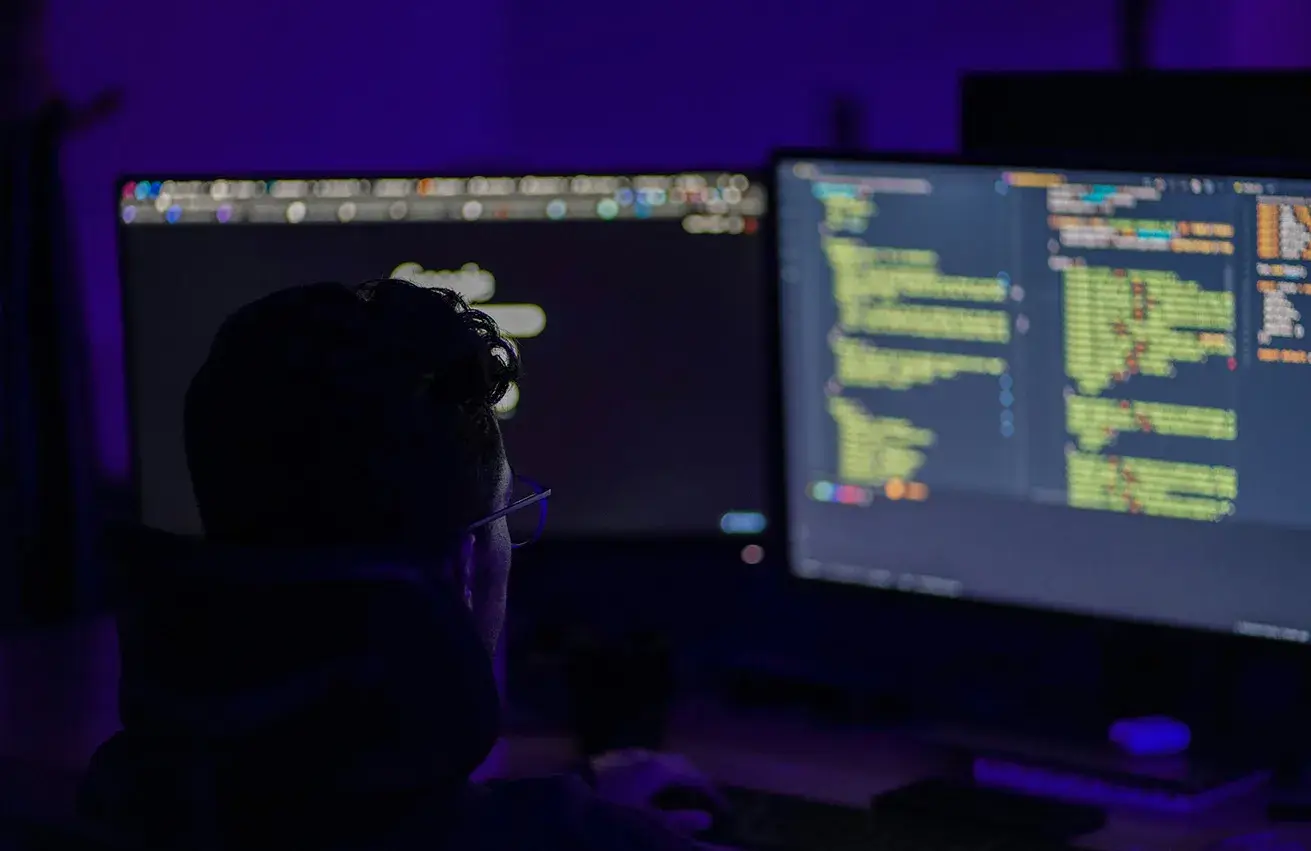 Man coding on computer