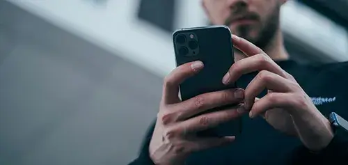 A man on his smart phone