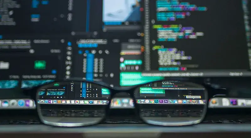 Glasses in front of computer monitors